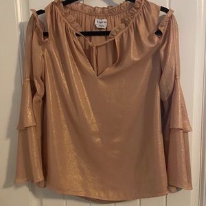 BeBe shimmery cut out blouse.